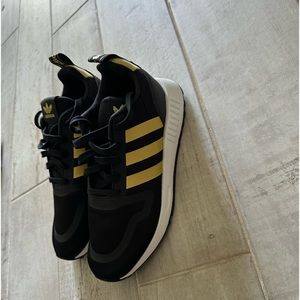 Black and gold Adidas